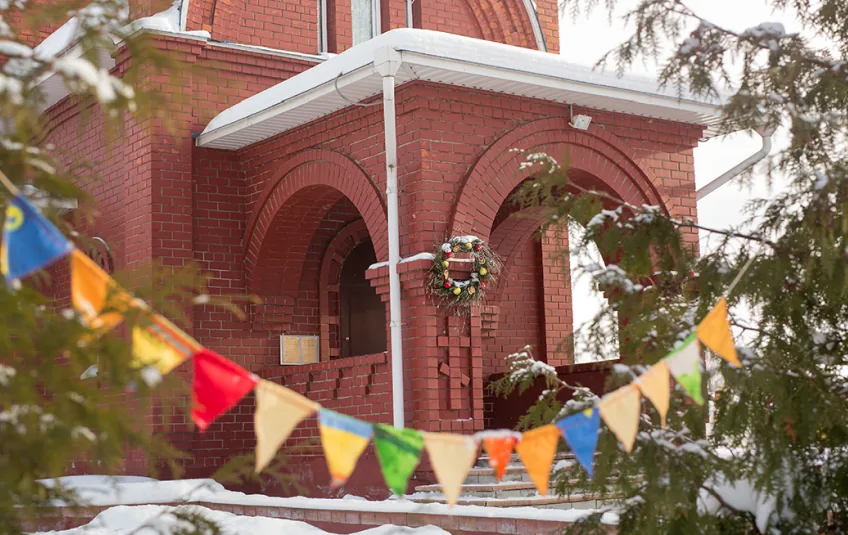 Church fall festival with inflatable attractions and a crowd