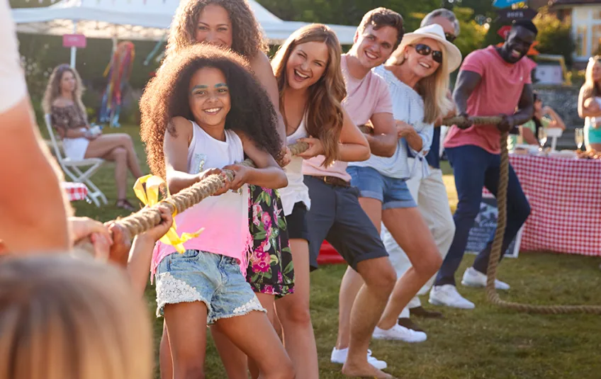 School carnival with inflatables on a campus field